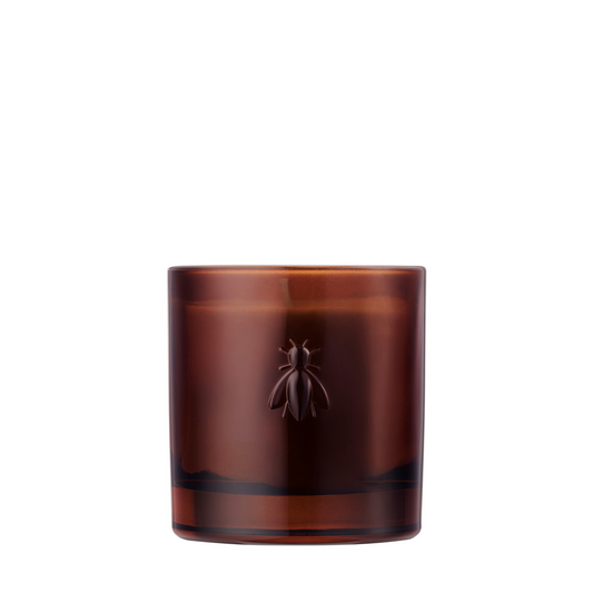 A product photograph showing the La Rochère Orange Blossom scented candle in a transparent glass jar featuring the classic embossed bee design