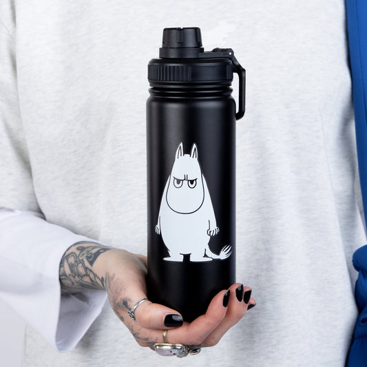 Woman holding a beige Moomintroll Thermal Everyday Bottle with Moomin illustrations by Nordicbuddies