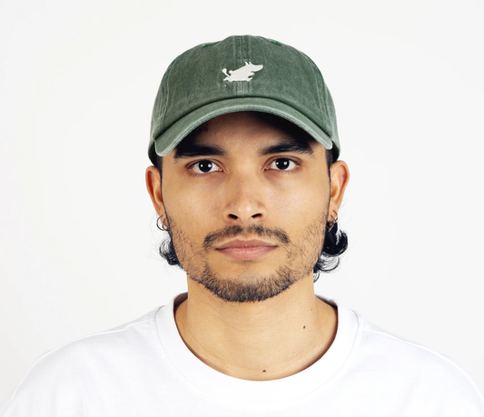 Male Model wearing the green washed denim Moomintroll adult cap