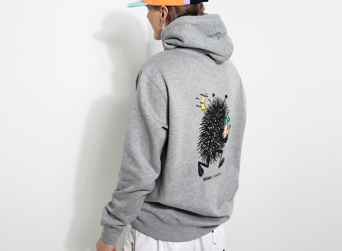 Model wearing Premium Unisex Heavy Cotton Hoodie Stinky - Grey back view