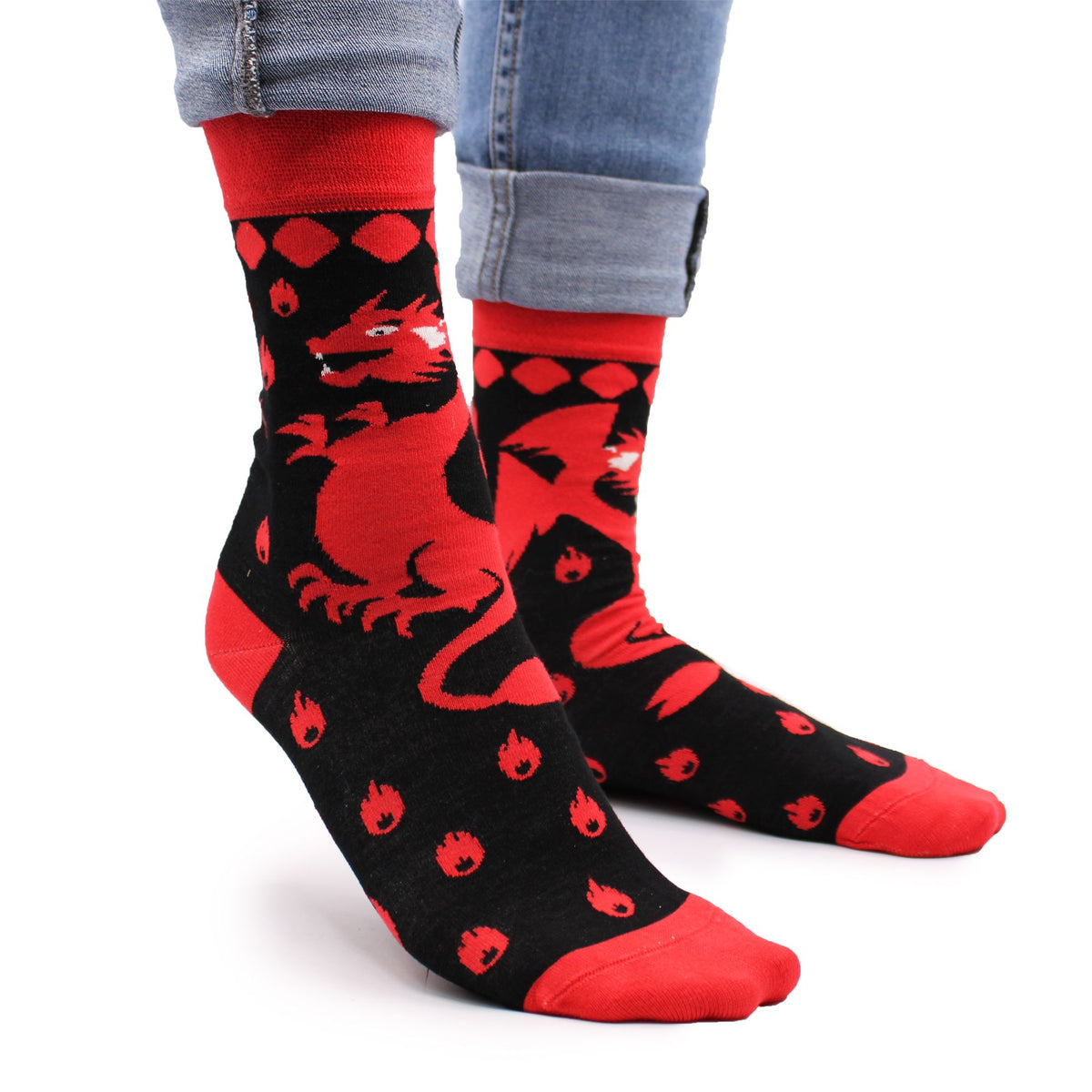 Side view of Hop Hare Red Dragons bamboo socks worn barefoot, showcasing the fiery dragon motif on the ankle