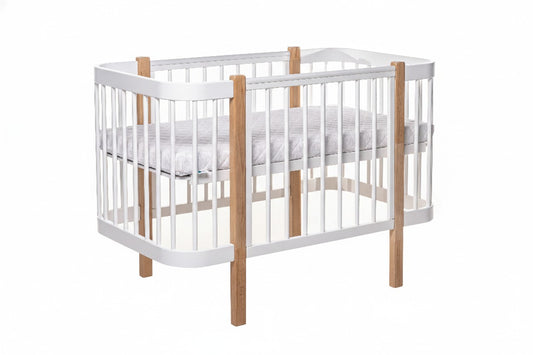 Next level of Ergonomic newborn mattress fitted inside the Scandinavian style KOTTO crib