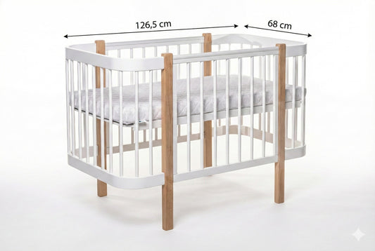 Measures of KOTTO Elin baby crib featuring a Scandinavian natural wood and white finish