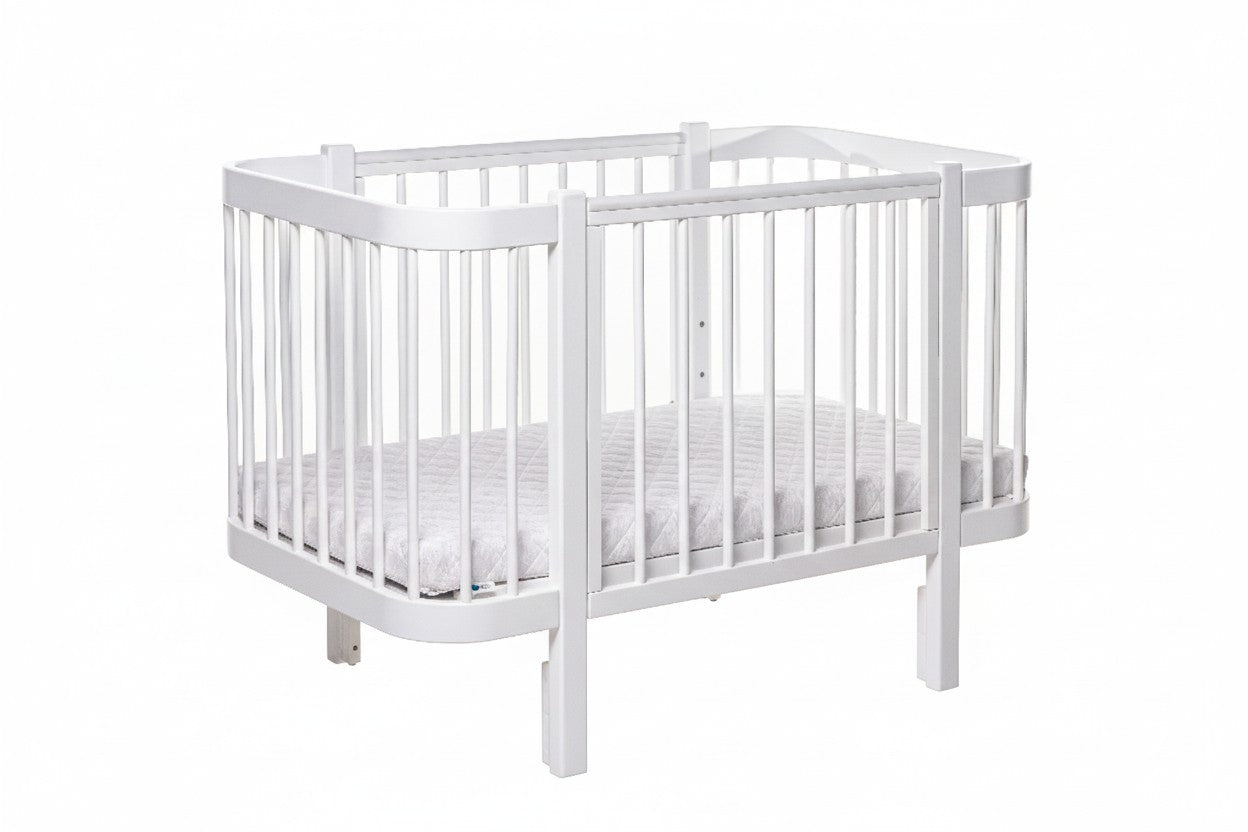 Clean and bright baby room decorated with the Elin white wooden crib