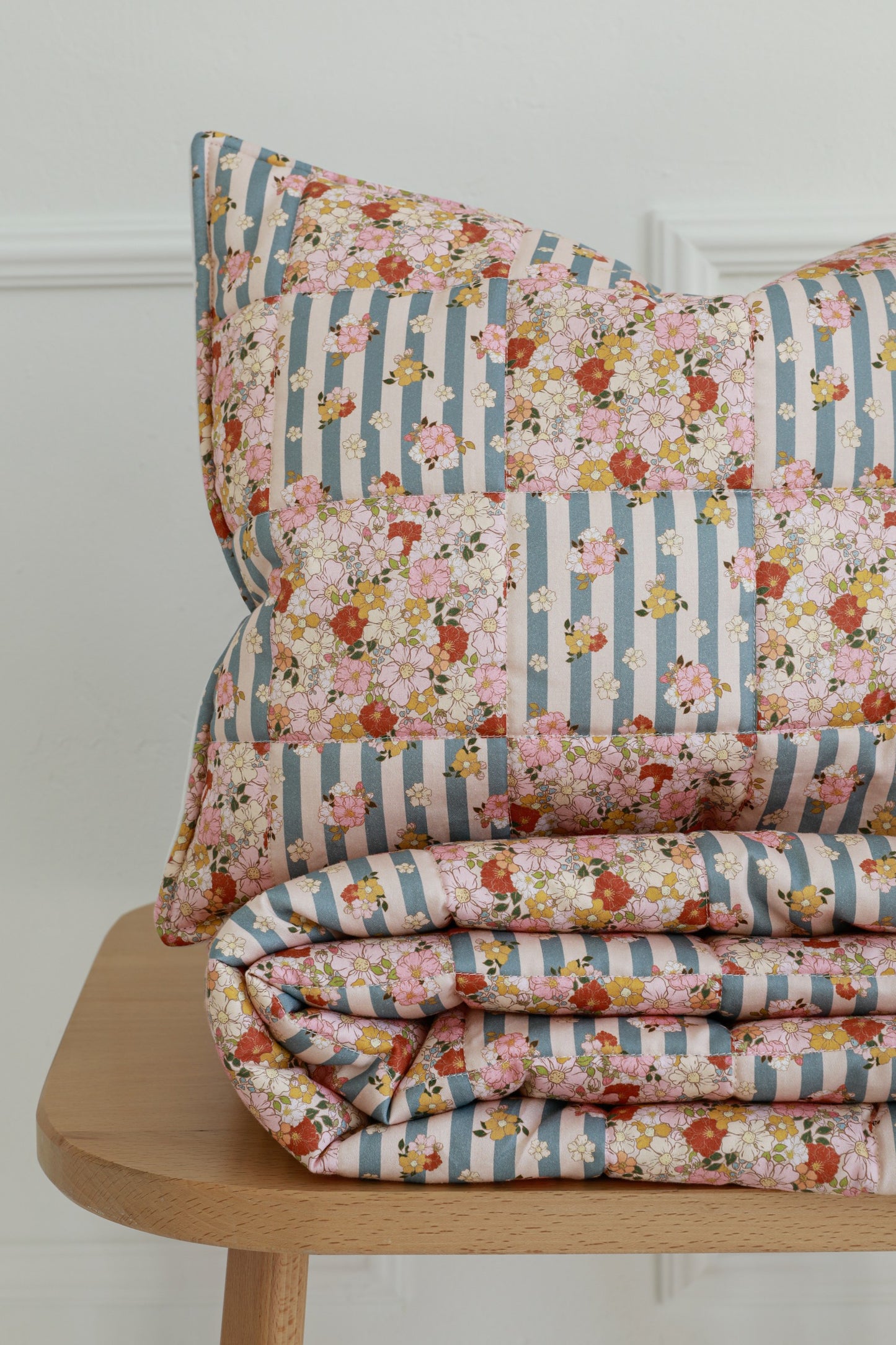 Close-up of the Summer Garden small quilted patchwork pillow and stitching