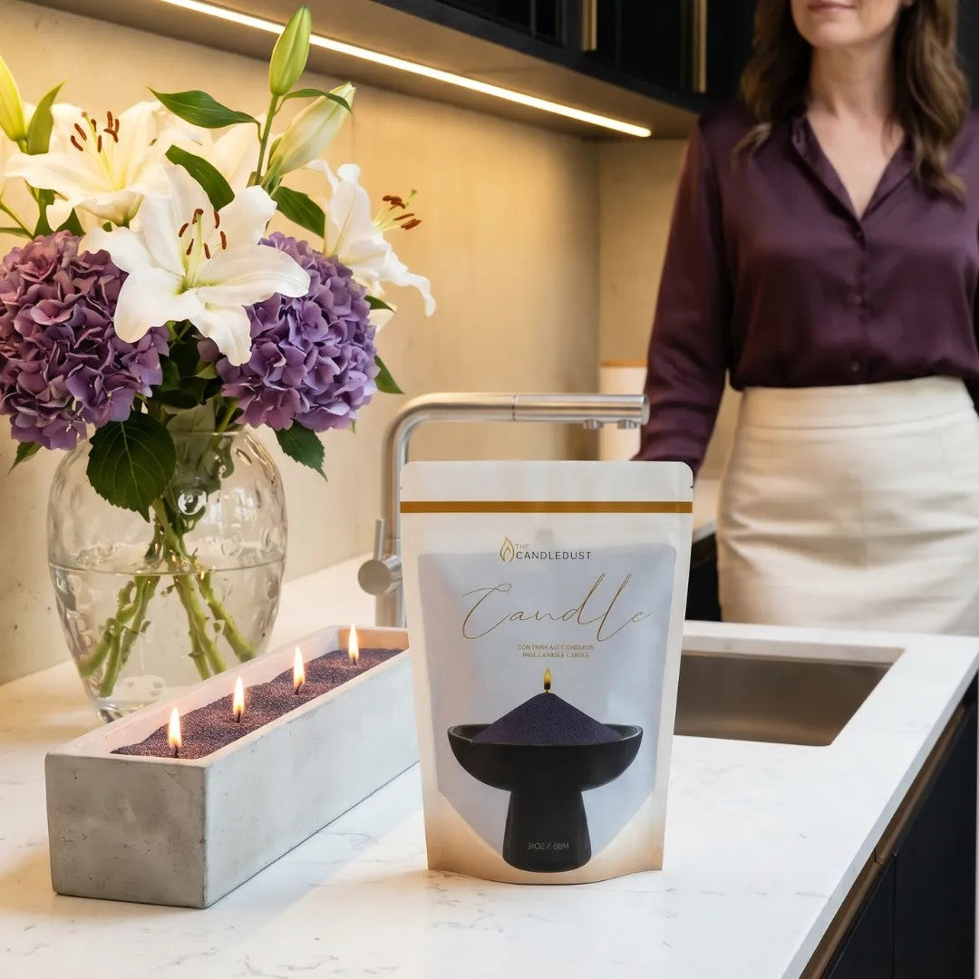 Modern home interior styling featuring an unlit Dark Lilac pearled sand candle and 1kg refill pouch on an marble countertop