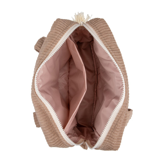 Lifestyle: Neutral Latte makeup bag in a boho-style nursery interior