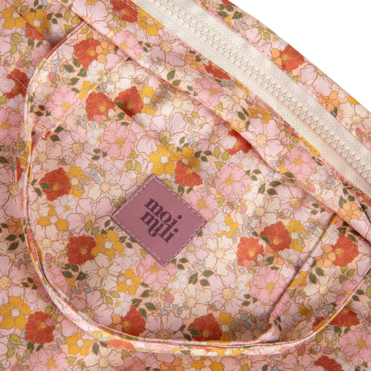 Close-up of the Spring Garden delicate floral fabric and zip closure