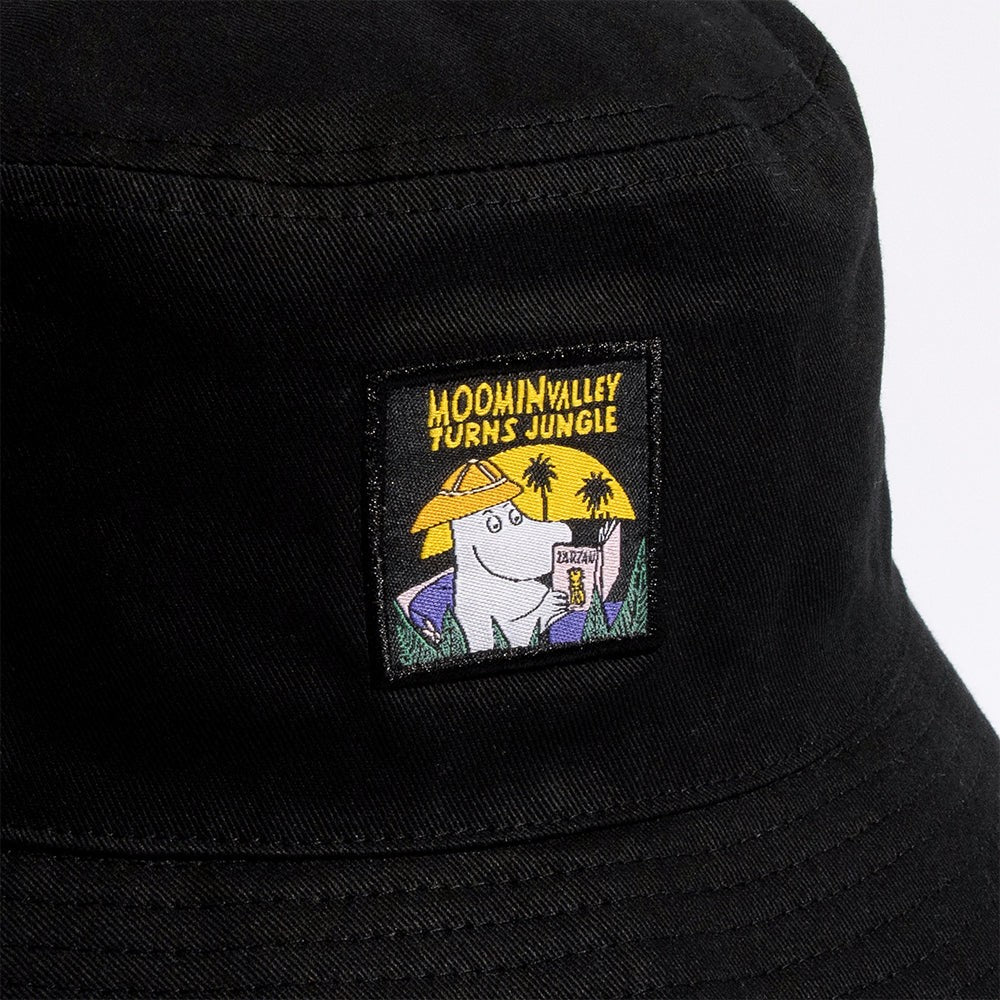 Close-up shot showing the black cotton fabric texture and detailed Moomin Jungle print by Nordicbuddies