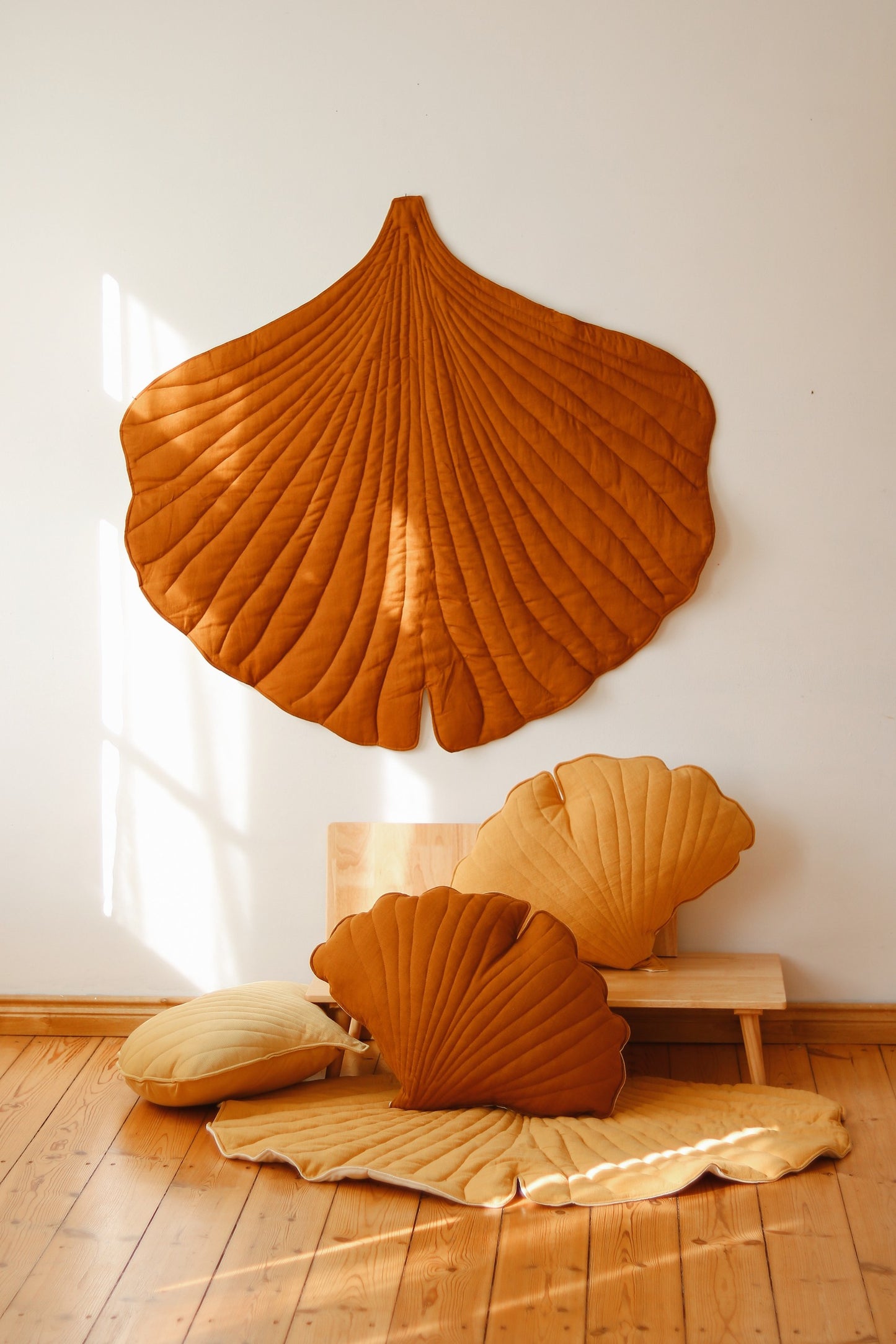 Autumn vibes: Caramel linen leaf mat on a natural wood floor