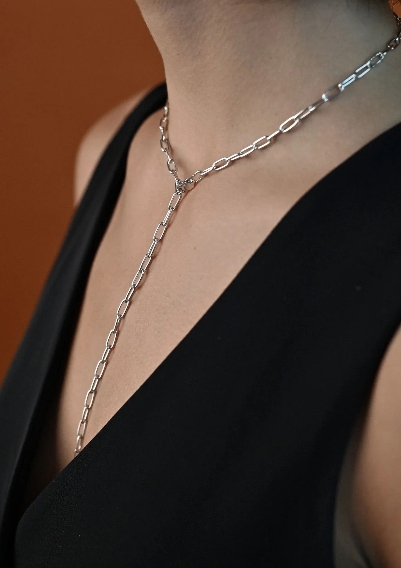 Detail shot highlighting the chain links of the handmade silver Paper Clip Y-Necklace.