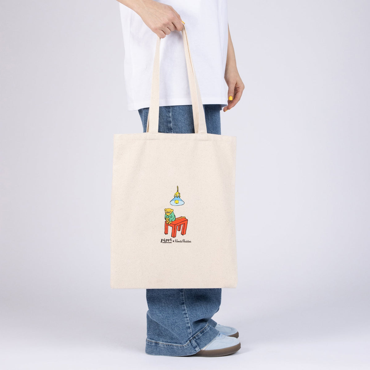 Model wearing natural white Pippi Longstocking tote bag back view
