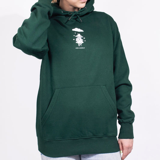 Model wearing the official Moomin Snufkin premium cotton hoodie in an outdoor casual setting