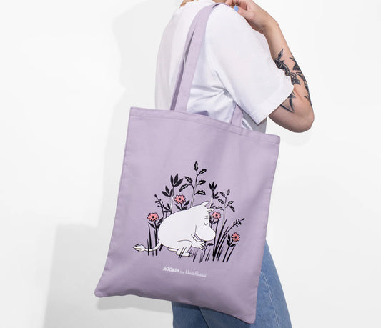 Model carrying the purple Moomintroll Canvas Tote Bag over the shoulder