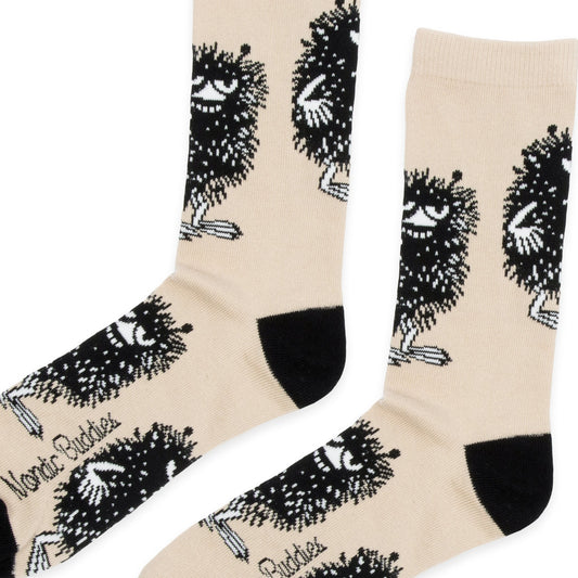 Close-up of woven Stinky character pattern and fine knit cotton texture on men's socks