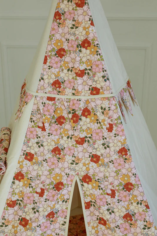 Detailed view of the delicate spring flower pattern on durable white canvas fabric for kids