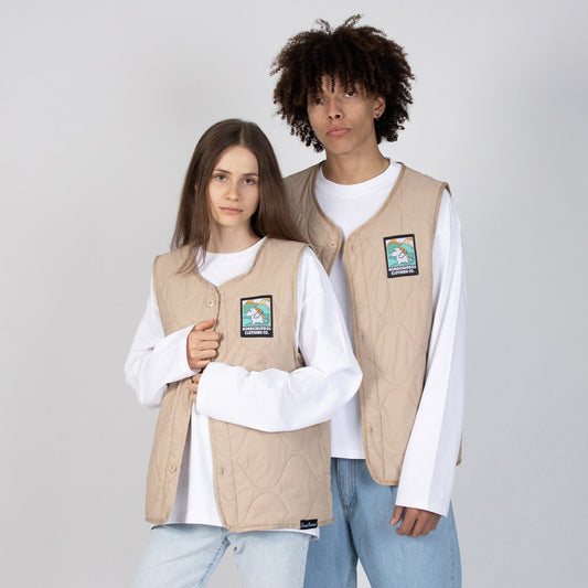 Male and Female Models wearing the Moomin Moomintroll Adventure unisex vest layered over a white shirt