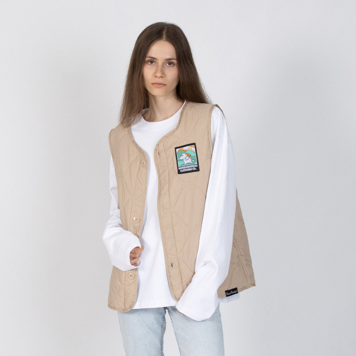 Female Models wearing the Moomin Moomintroll Adventure unisex vest layered over a white shirt