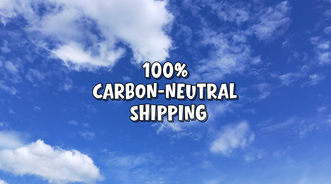 Clear blue sky with white clouds and text overlay reading 100% Carbon-Neutral Shipping for That Green Store vegan shop