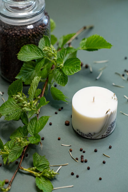 Top View Juniper candle lit in a kitchen to provide a fresh outdoor aroma