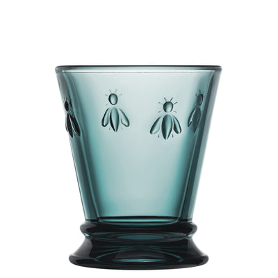 Single La Rochère Bee water glass 250ml in sapphire blue showing the relief bee pattern