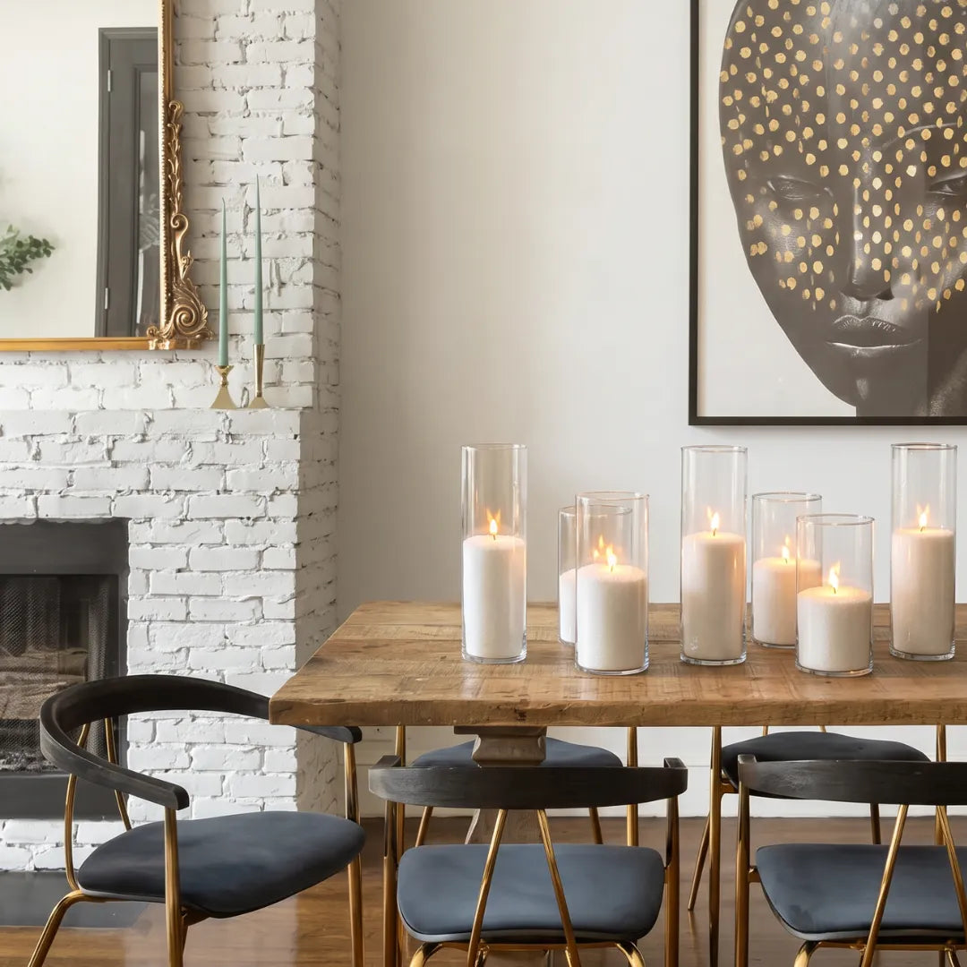 Glass vases of various heights filled with burning Diamond Dust pearled candle sand creating a glowing cluster