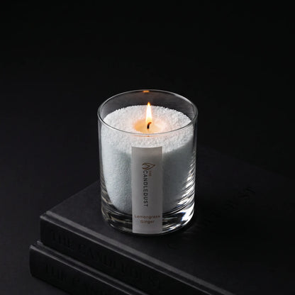 Lit Candledust Lemongrass Ginger scented pearled candle in a 160g glass jar on black background