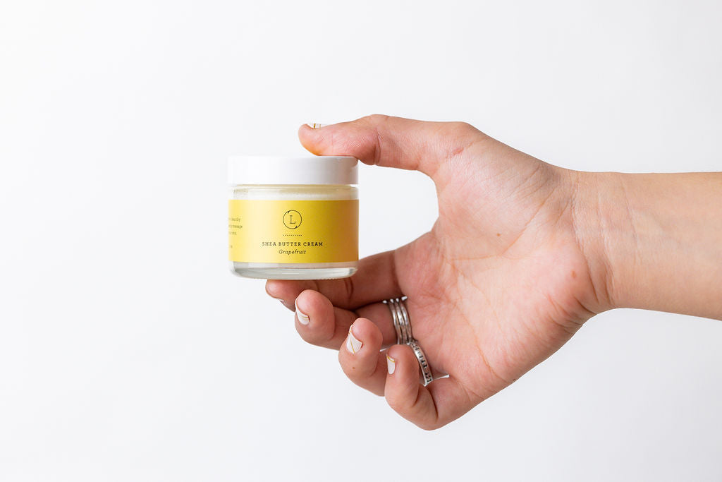 Woman hand Grapefruit Shea Butter Body Cream - Natural moisturizing body butter jar | Lizush