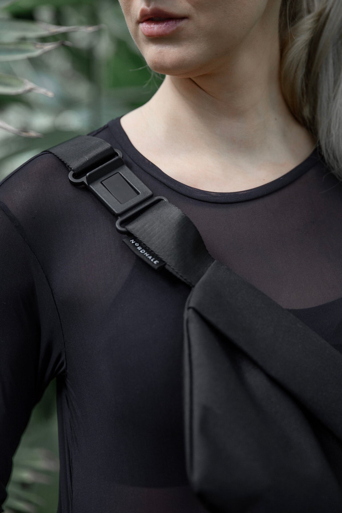 Model wearing OSLO Crossbody Bag in recycled felt, minimalist eco-friendly style - close up
