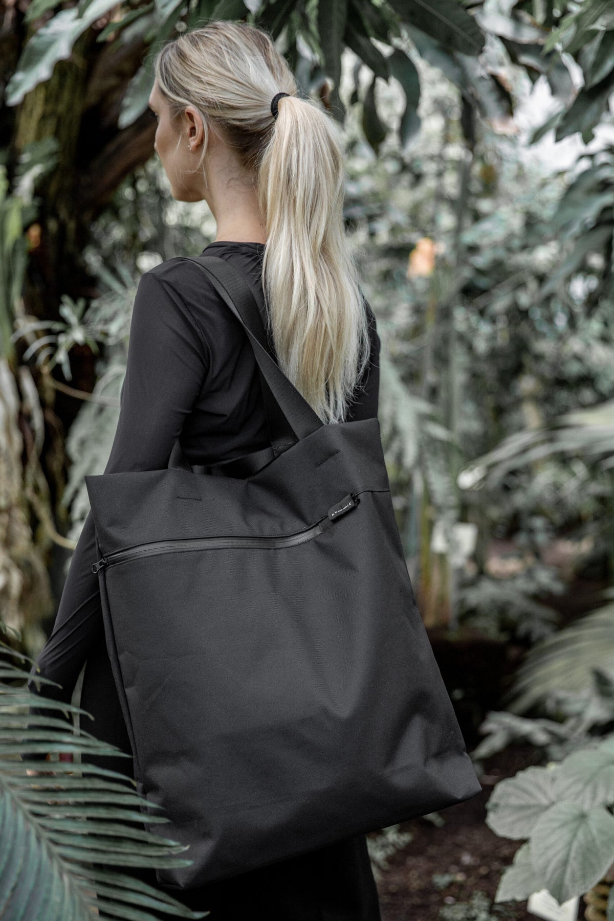 Model outdoors wearing minimalist dress with VIK Large Tote Bag, Scandinavian eco-friendly design