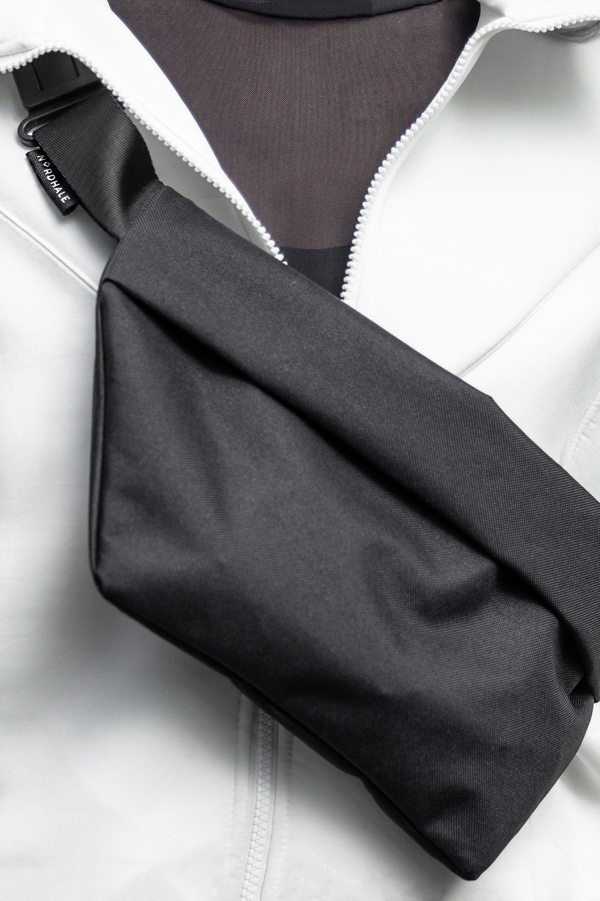 Model wearing OSLO Crossbody Bag front view in charcoal gray recycled felt, sustainable vegan bag