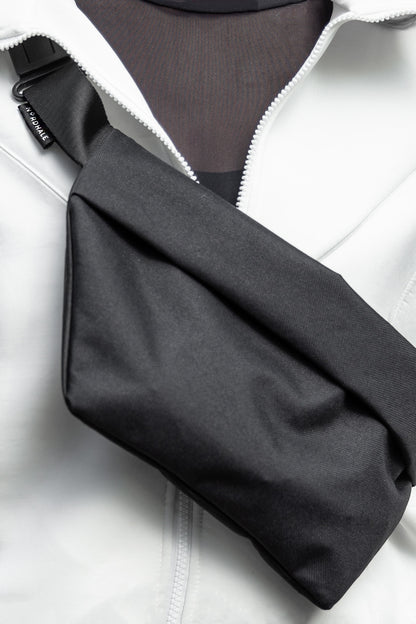 Model wearing OSLO Crossbody Bag front view in charcoal gray recycled felt, sustainable vegan bag