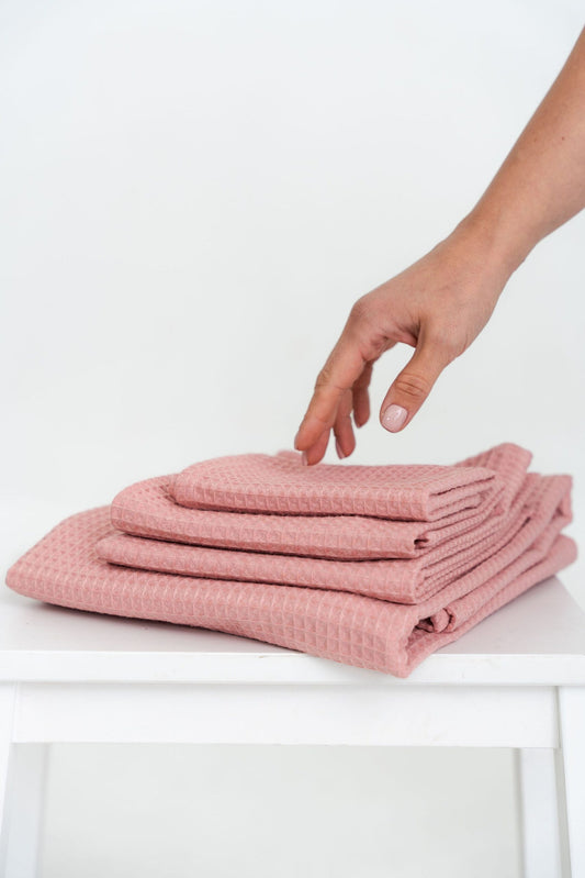 4-Piece Peach Organic Waffle Cotton Towel Set Folded Stack | NUSS