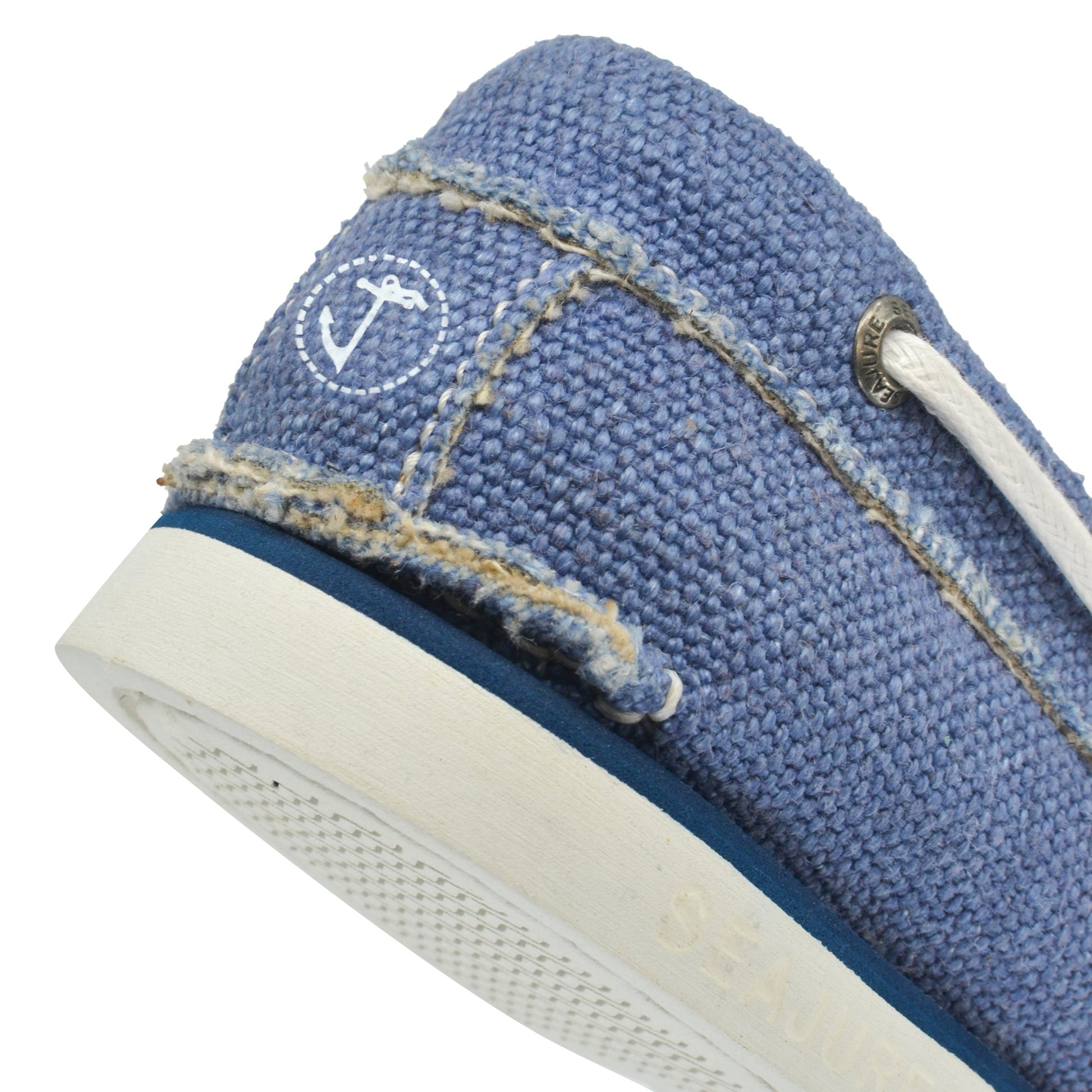 Close-up heel detail of Seajure Fidden showing logo emblem and organic hemp fabric texture