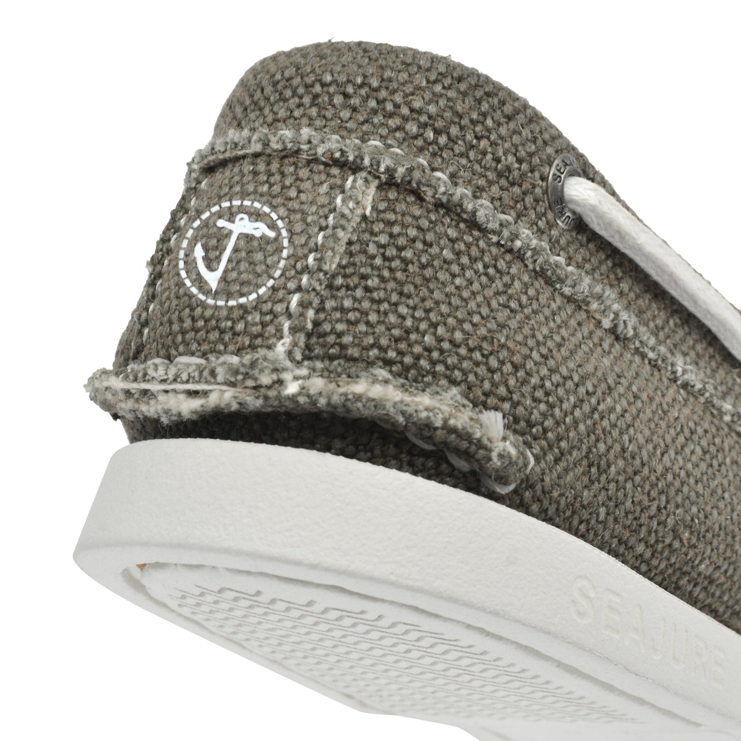 Close-up heel detail of Seajure Scopello showing logo emblem and organic hemp fabric texture
