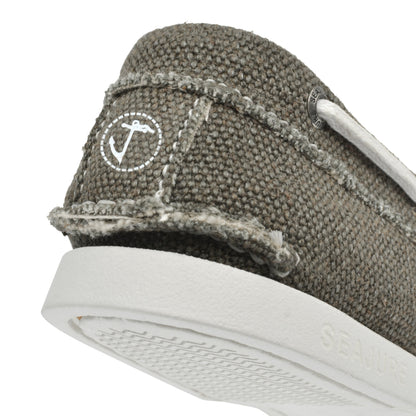 Close-up heel detail of Seajure Scopello showing logo emblem and organic hemp fabric texture