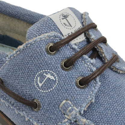 Close-up of detail of Seajure Pampelonne showing logo emblem and organic hemp fabric texture