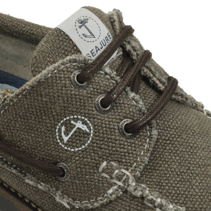 Close-up detail of Seajure Vik showing logo emblem and organic hemp fabric texture