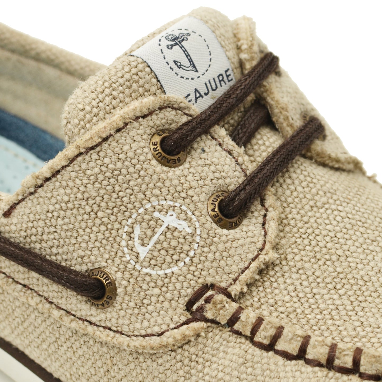 Close-up of detail of Seajure Achmelvich showing logo emblem and organic hemp fabric texture