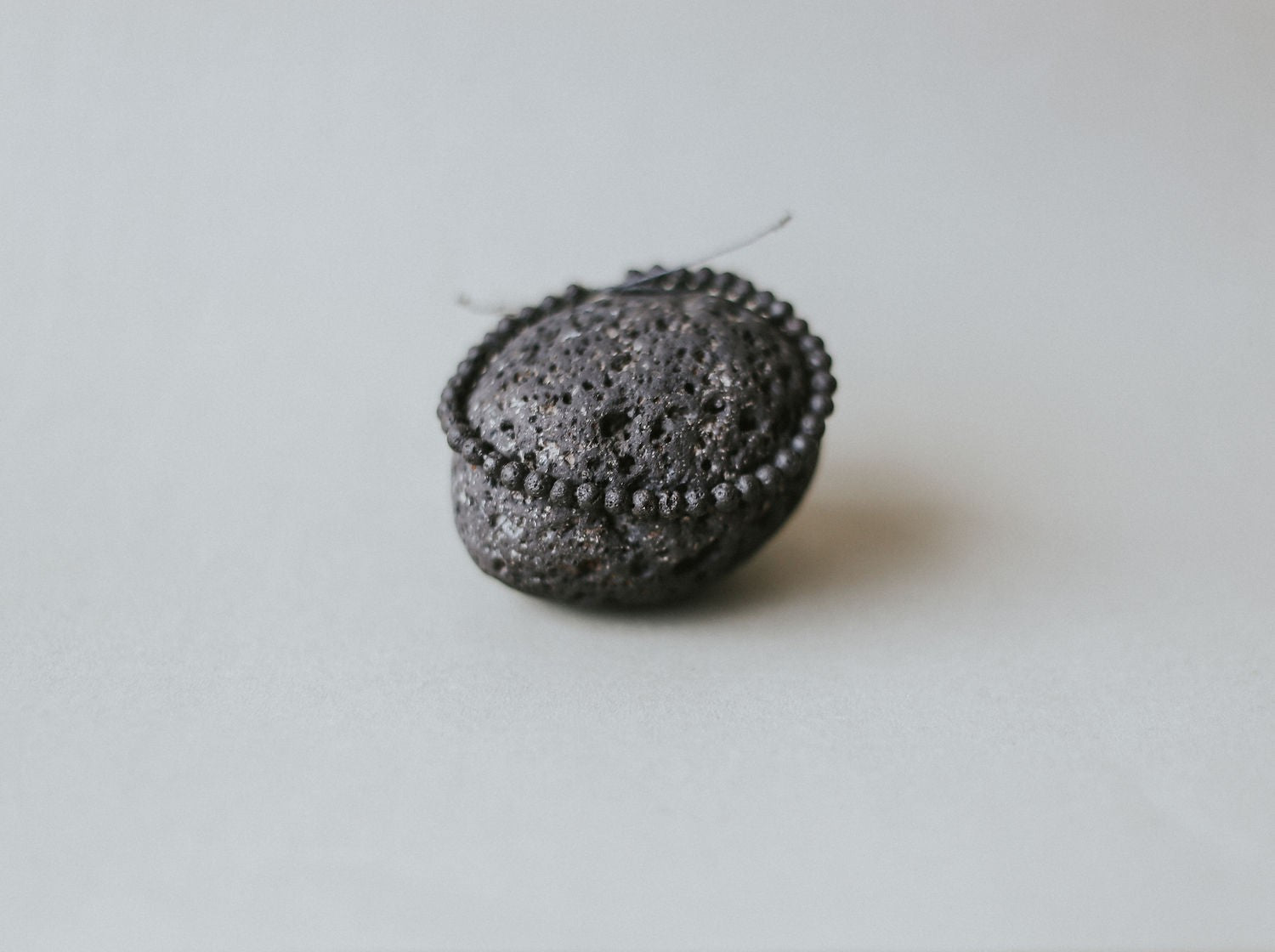 Detail of Adjustable minimalist bracelet with 4mm porous black lava beads on a durable cord