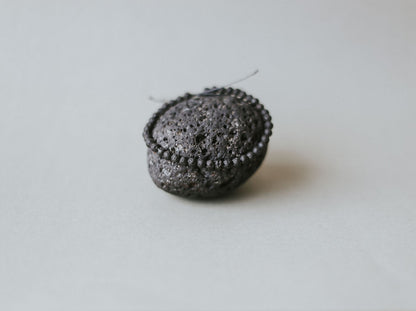 Detail of Adjustable minimalist bracelet with 4mm porous black lava beads on a durable cord