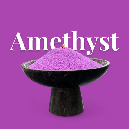 Amethyst text on a matching purple background with a dark vase full of unlit pearled candle sand in the foreground
