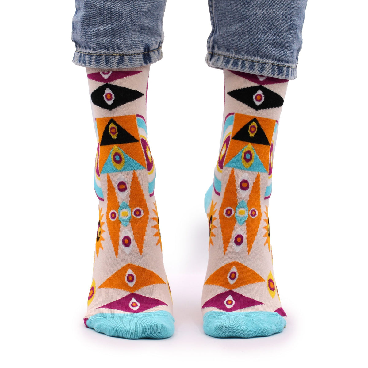 Front view of Psychedelic Evil Eye eco-friendly bamboo socks worn on bare feet, highlighting the surreal trippy pattern