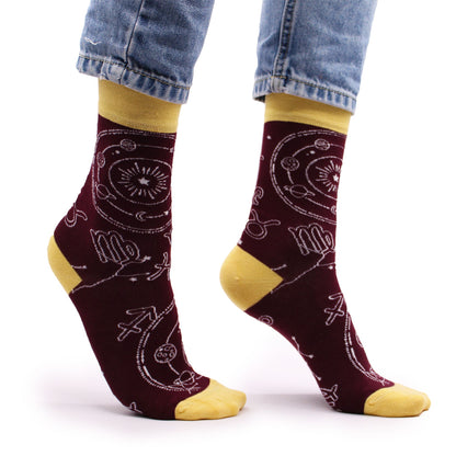 Side view of Hop Hare Zodiac bamboo socks worn barefoot, showcasing the astrological symbol motif on the ankle