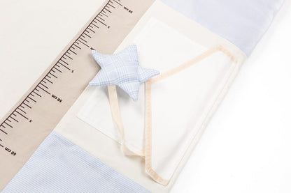 Close-up of detail of Karloova organic cotton baby activity mat with sensory play arches, 120x120cm - Blue
