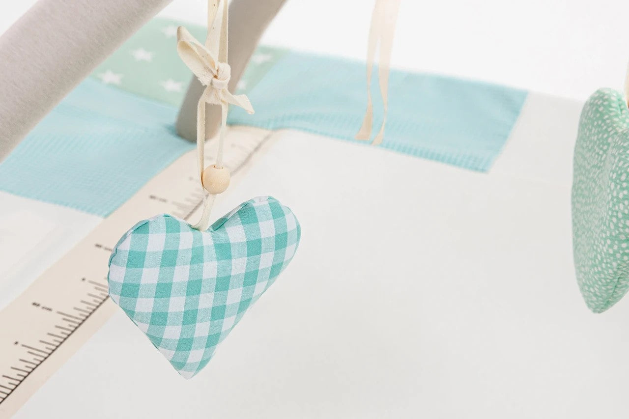 Close-up Eco-friendly soft baby play mat featuring hanging rattling and crinkling toys, 120x120cm - Mint Green