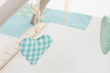 Close-up Eco-friendly soft baby play mat featuring hanging rattling and crinkling toys, 120x120cm - Mint Green