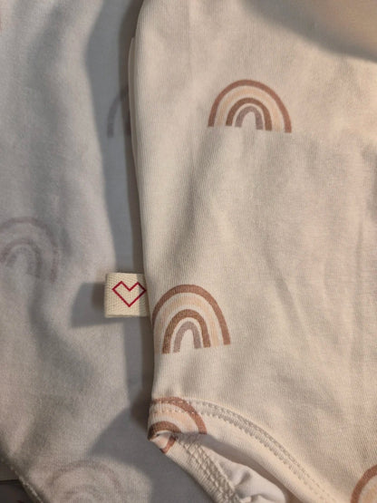 Close-up of skin-friendly breathable fabric on Karloova baby bodysuit - Rainbow