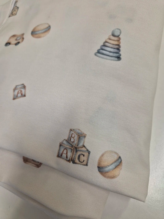 Close-up of skin-friendly breathable fabric on Karloova baby bodysuit - Toys
