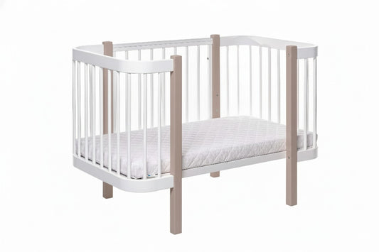 Minimalist nursery room equipped with the Elin cappuccino and white baby crib